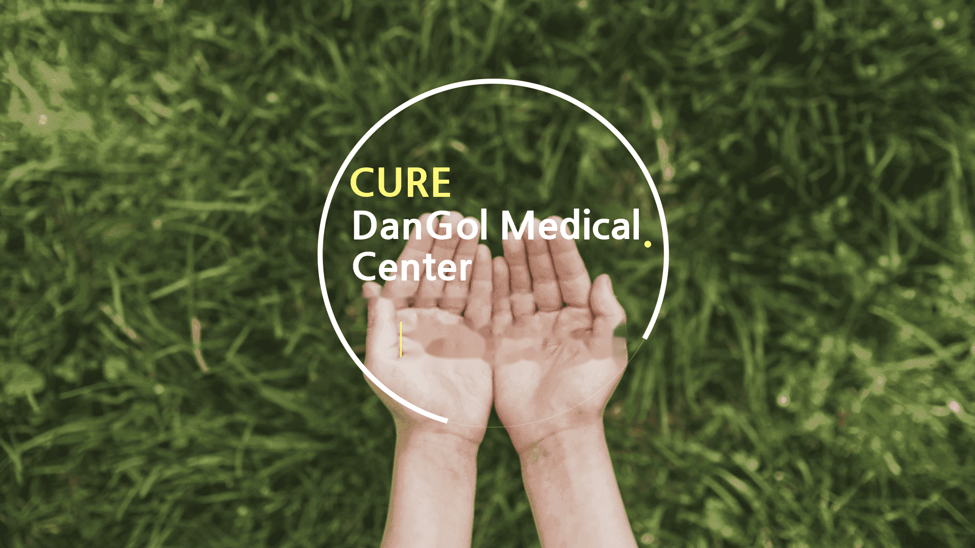 Cupped hands over grass