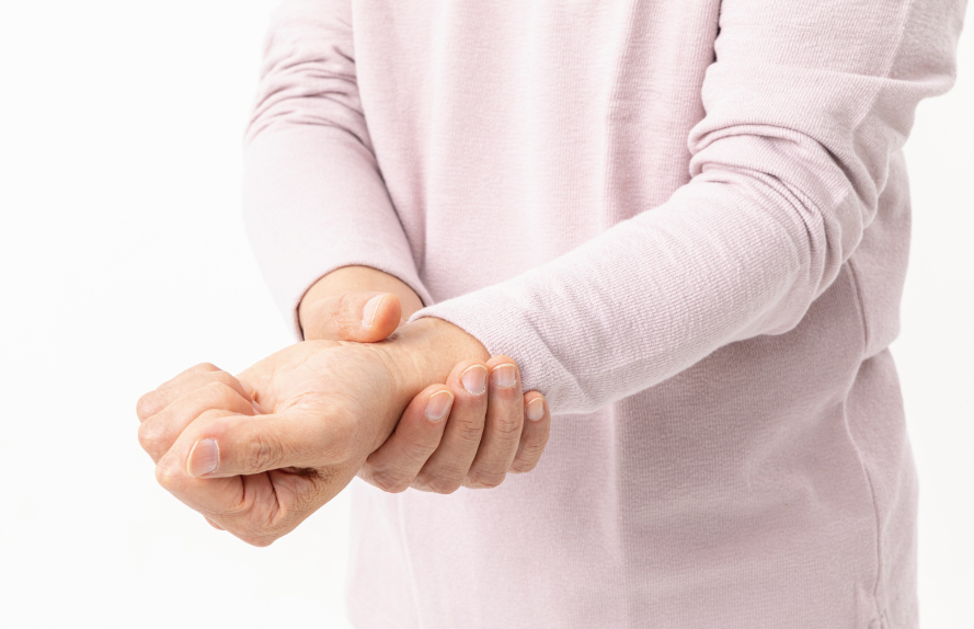 Person holding a painful wrist