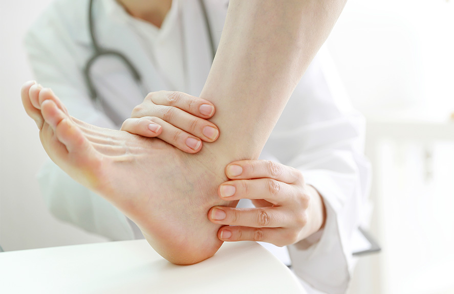 Doctor examining a patient's foot