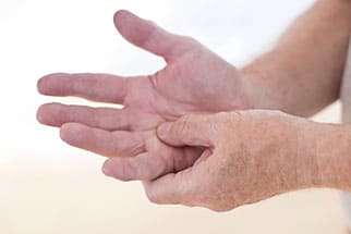 Person pressing the palm side of a finger