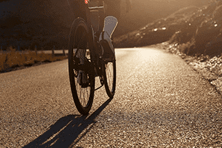 Person cycling on a road