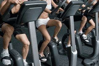 People on exercise bikes