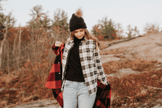 Woman putting on a jacket